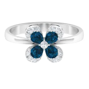 0.75 CT London Blue Topaz and Diamond Floral Ring