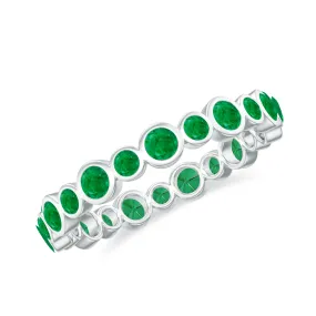 1 CT Emerald Uneven Eternity Ring in Bezel Setting