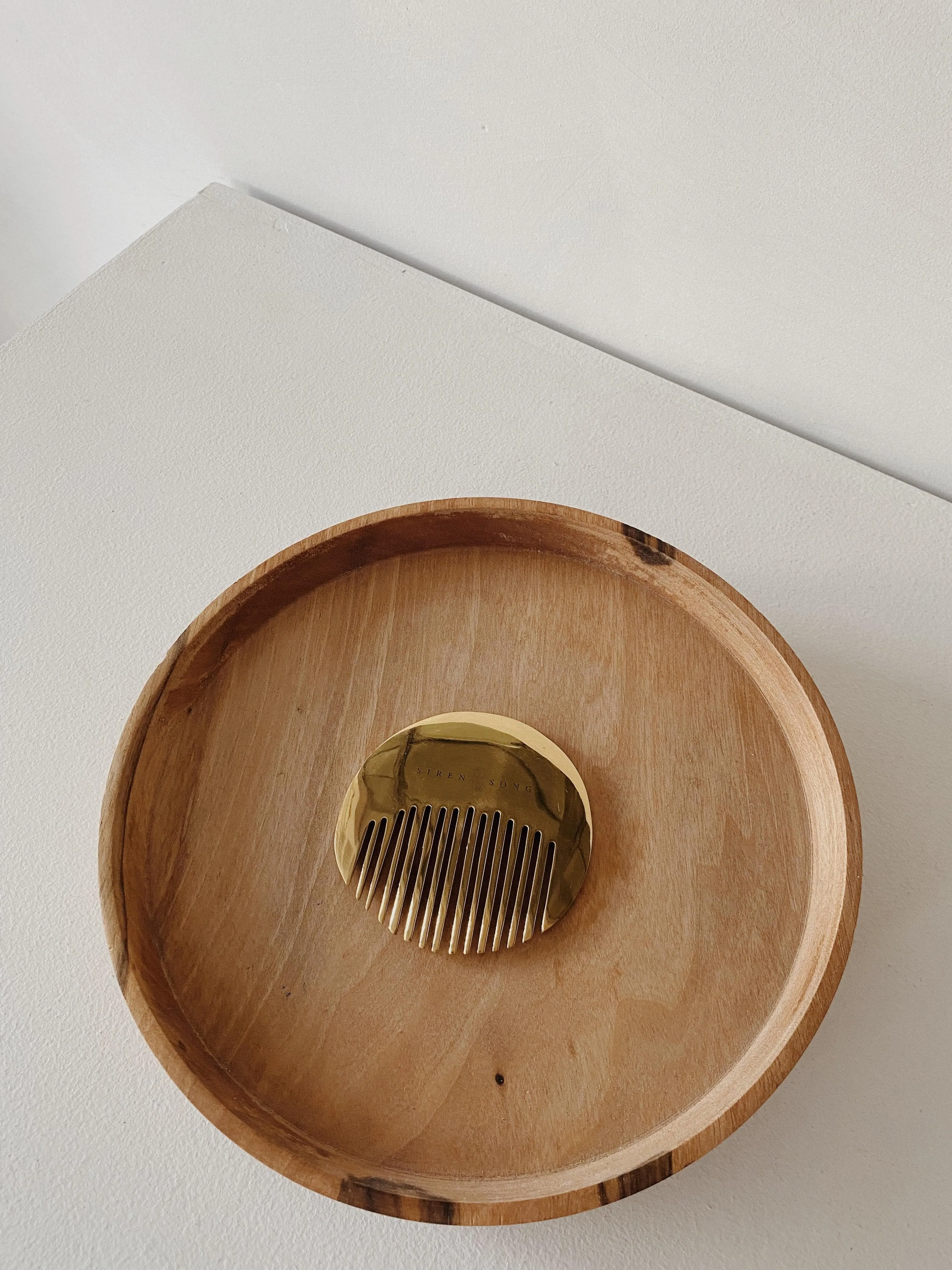 circle brass comb